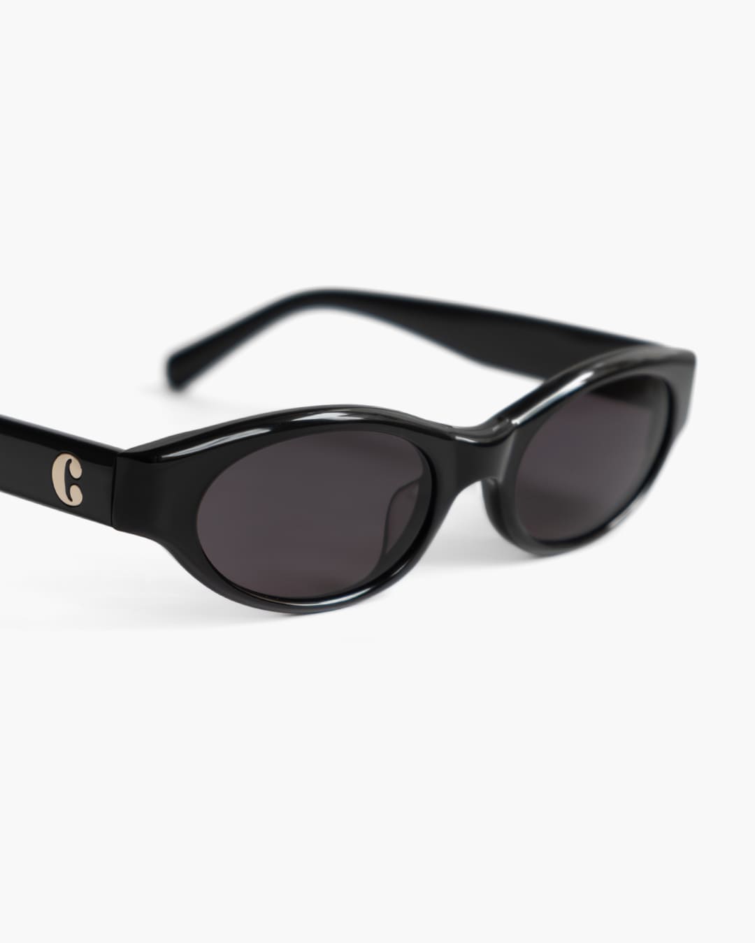 Black sunglasses with a logo on a white background