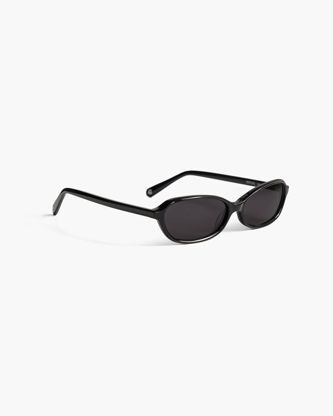 Black sunglasses on a white background slightly from the side