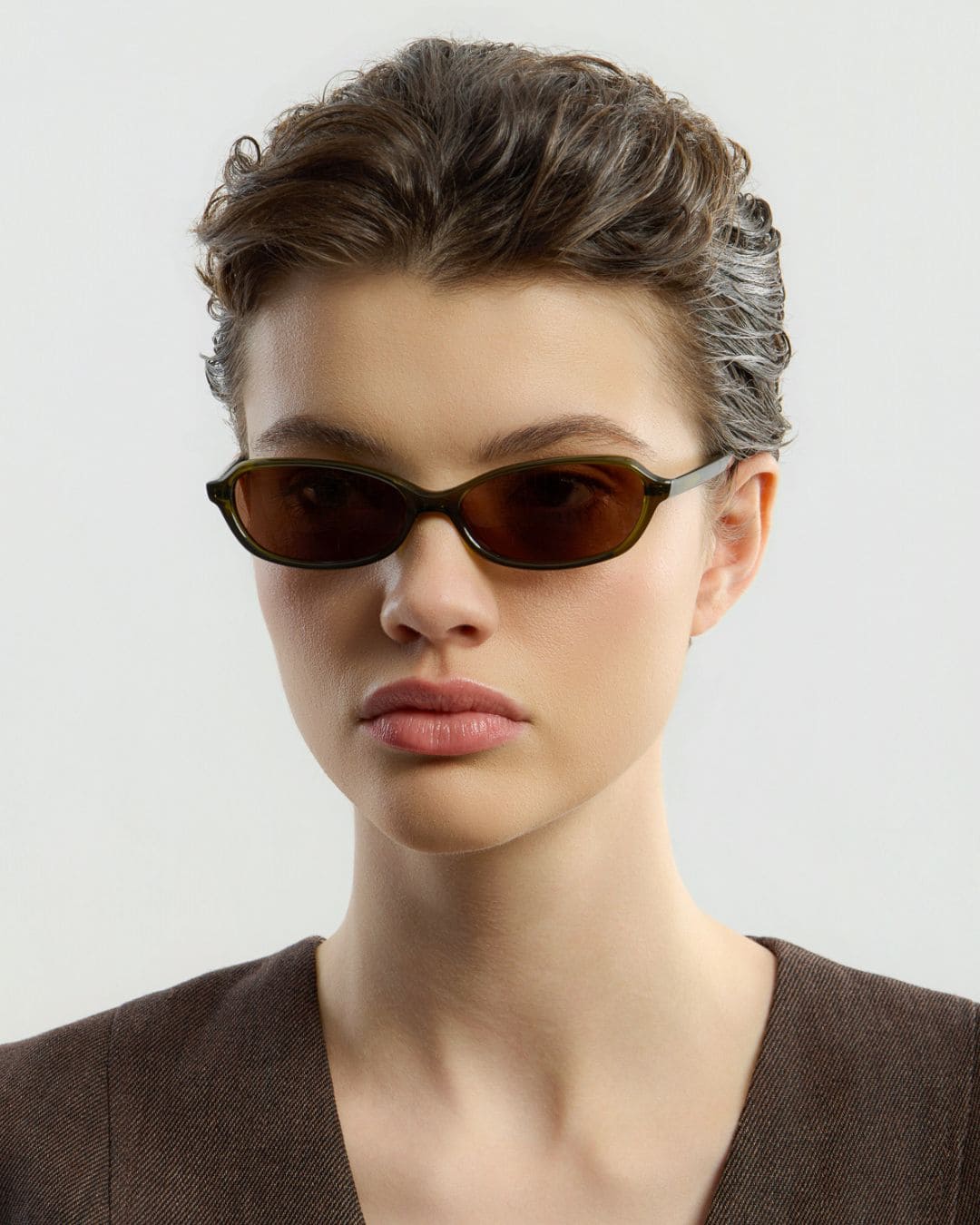 Woman wearing Ana Olive Brown sunglasses by Corlin from the side.