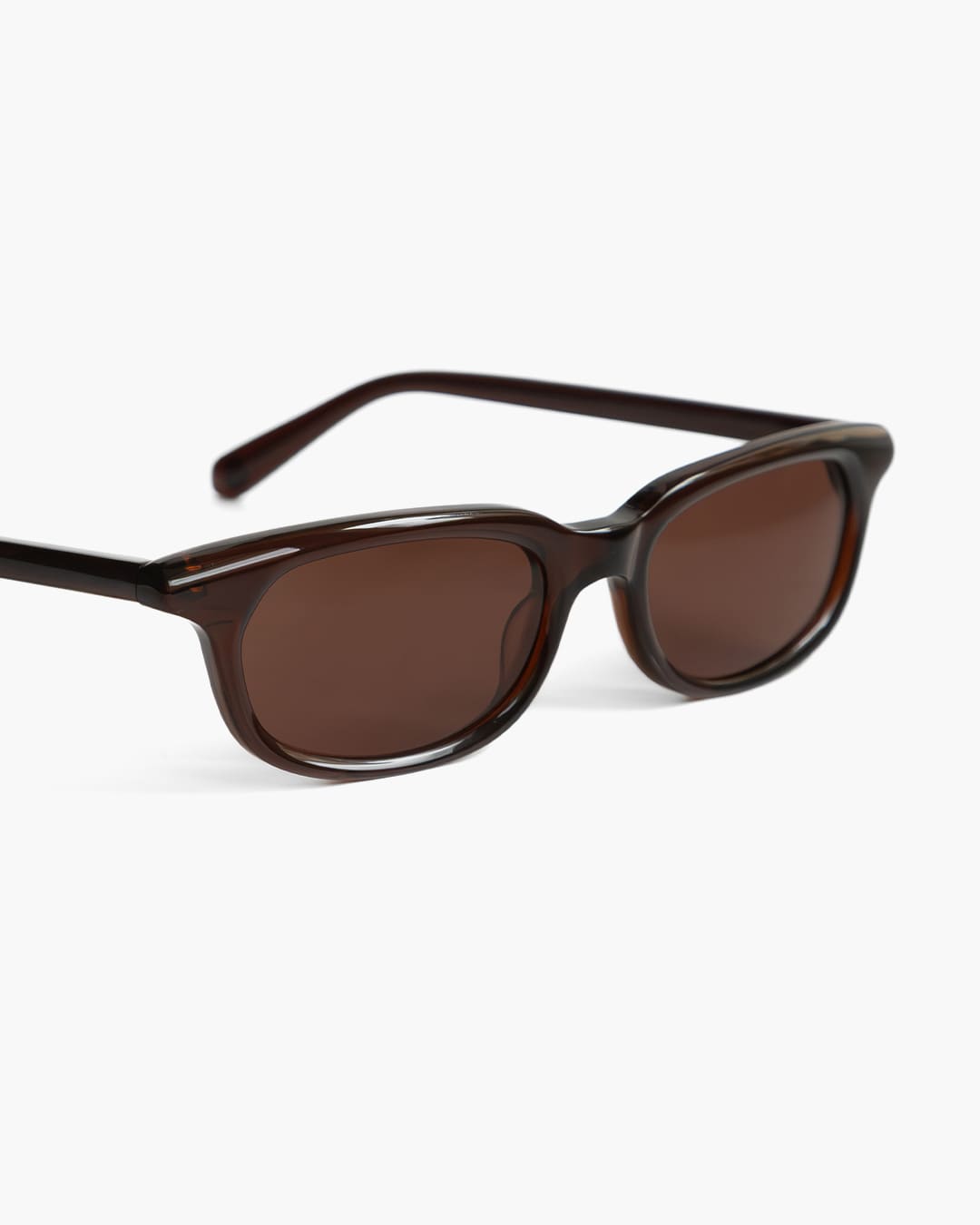 Closeup of brown sunglasses on a white background