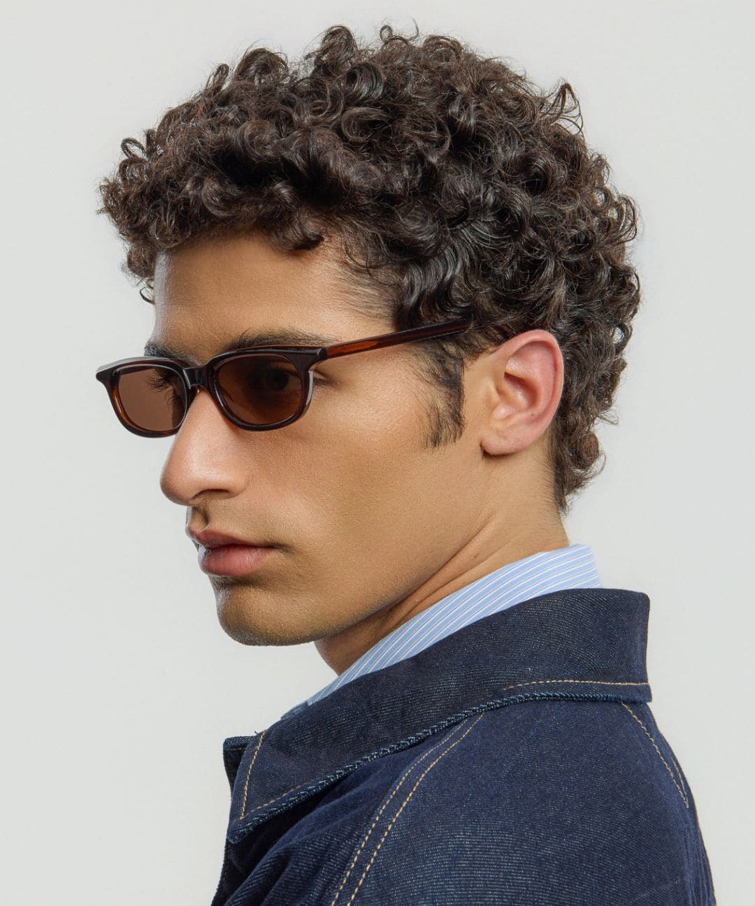 Male model wearing Corlin Eyewear Jean Brown Brown sunglasses — classic unisex eyewear, Scandinavian design