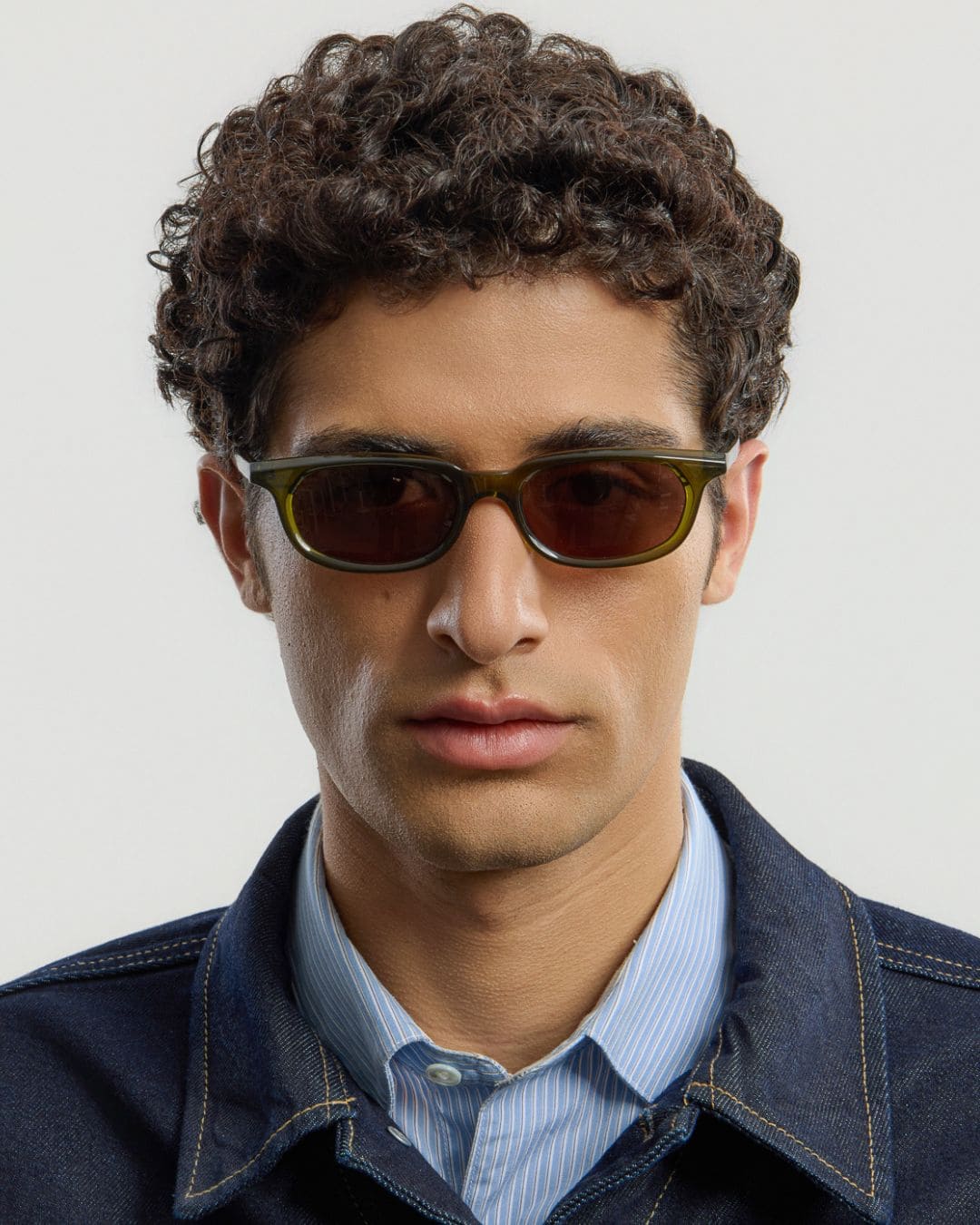 Man wearing Jean Olive Brown sunglasses by Corlin from the front.
