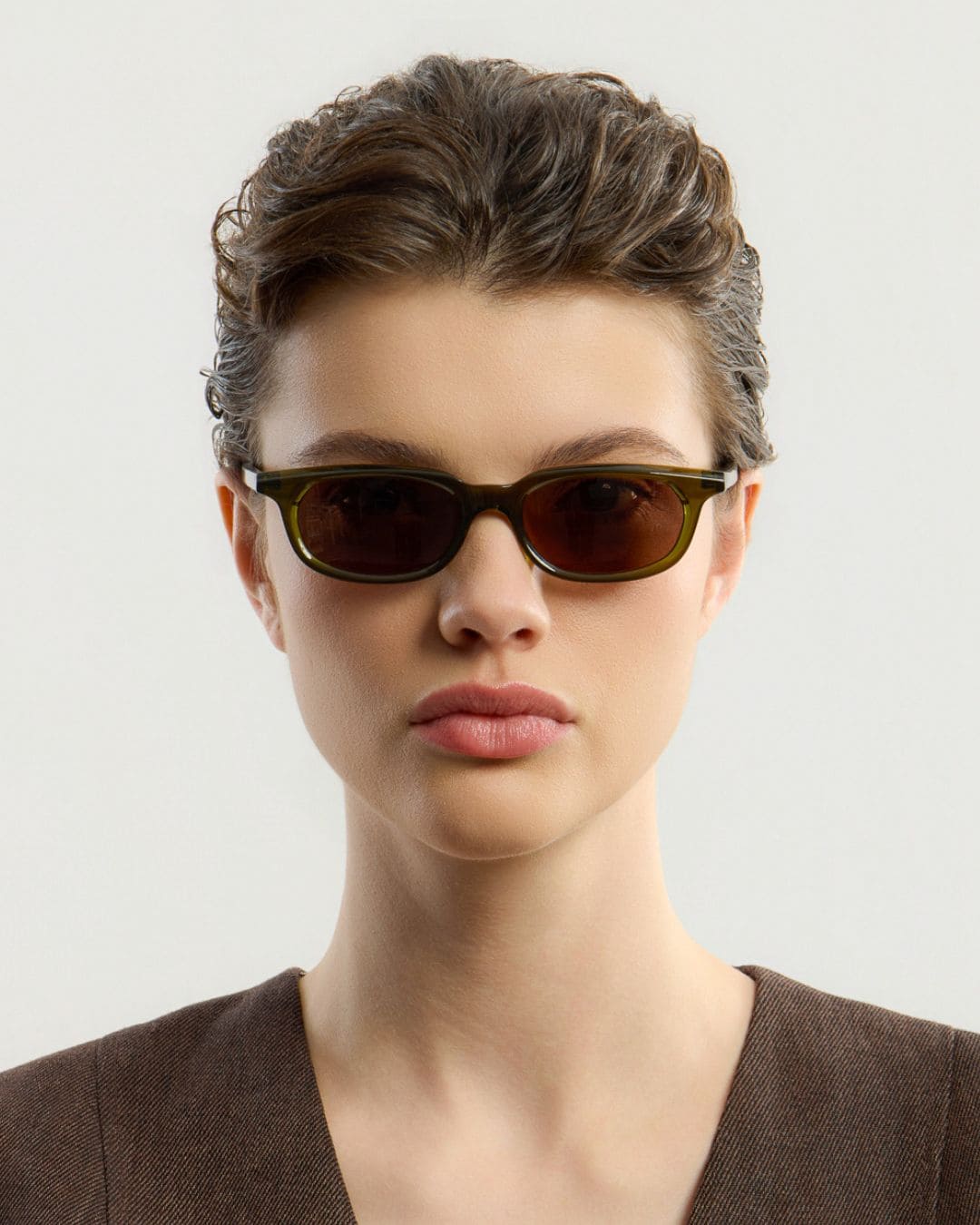 Woman wearing Jean Olive Brown sunglasses by Corlin from the side.