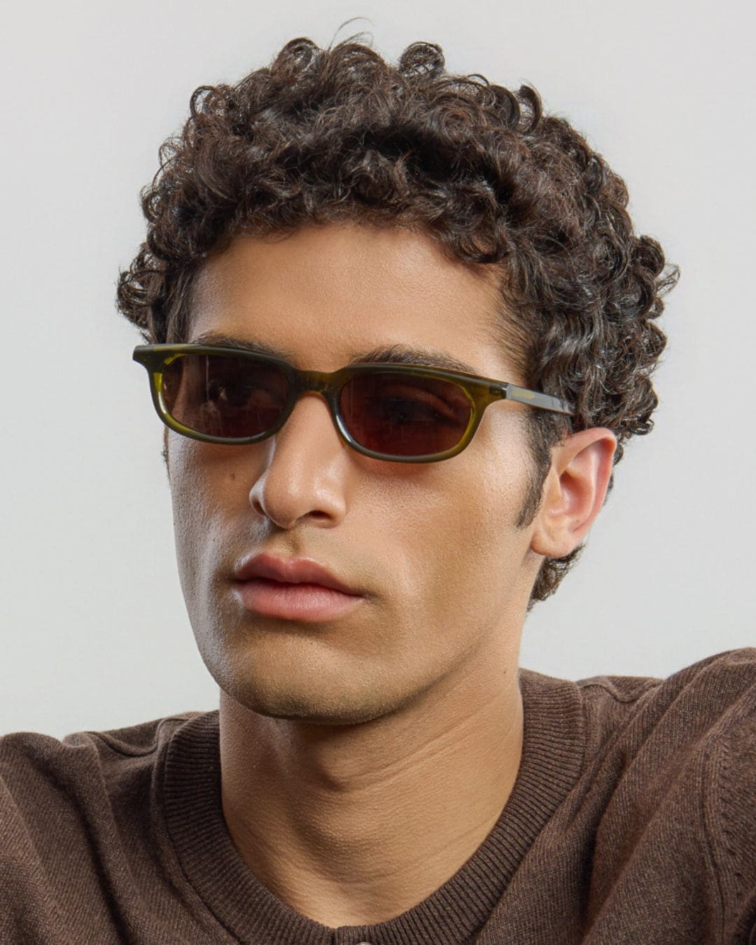 Man wearing Jean Olive Brown sunglasses by Corlin from the side.
