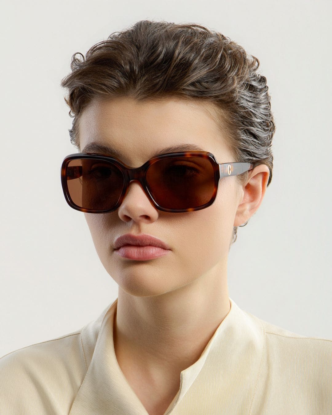Female model wearing Corlin Eyewear Lana Tortoise Brown sunglasses — side profile, Swedish minimalist design