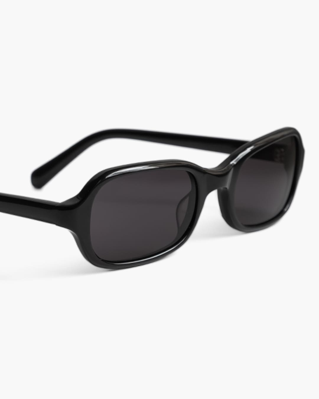Closeup of black sunglasses on a white background 