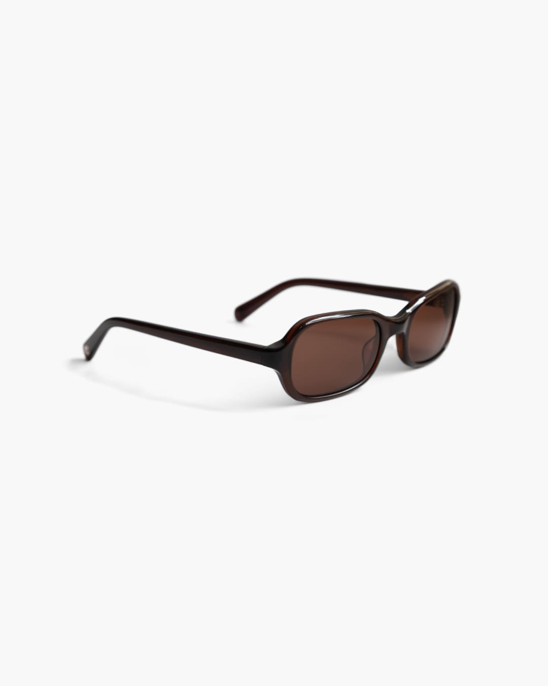 Brown sunglasses on a white background slightly from the side