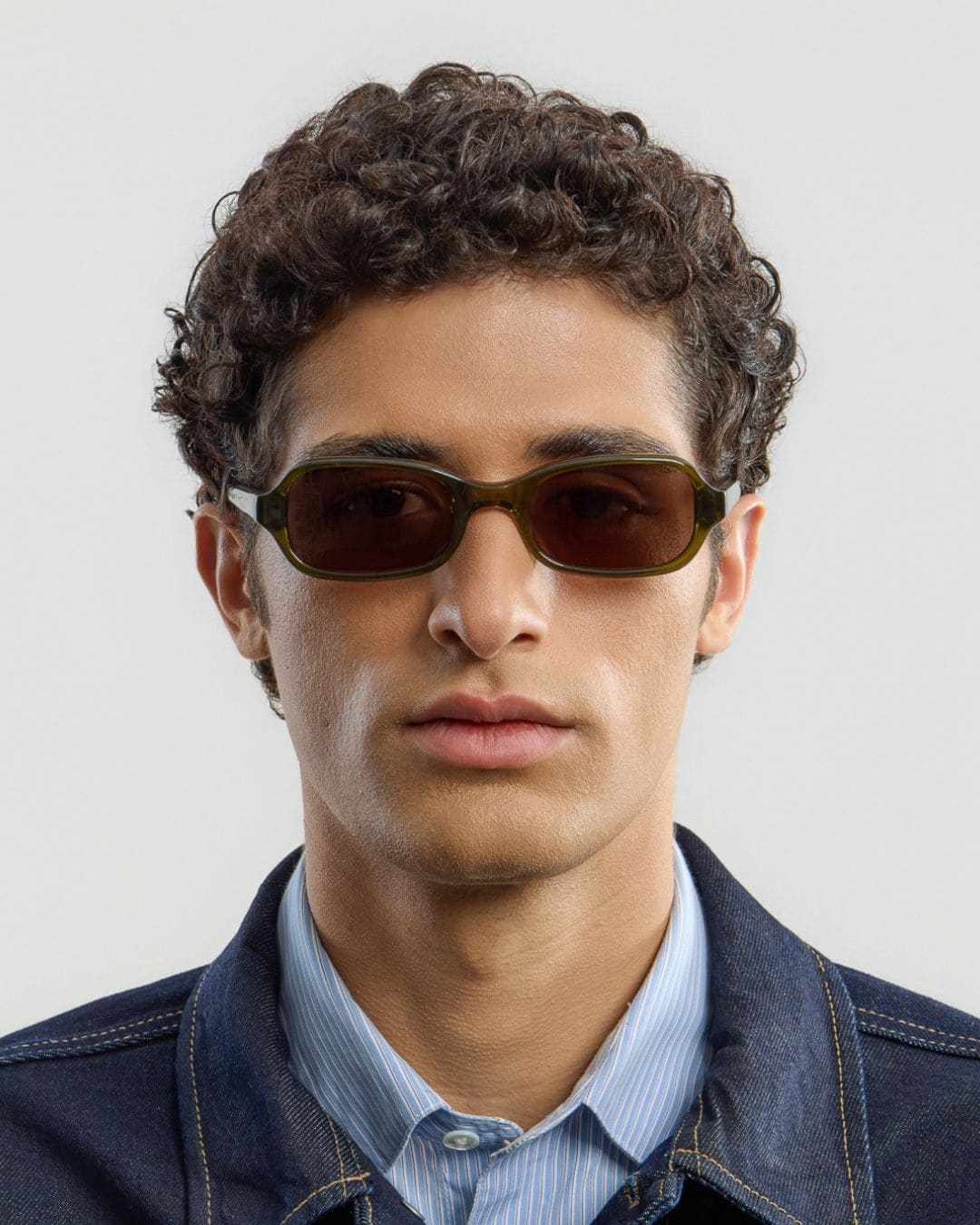 Man wearing Lou Olive Brown sunglasses by Corlin from the front.