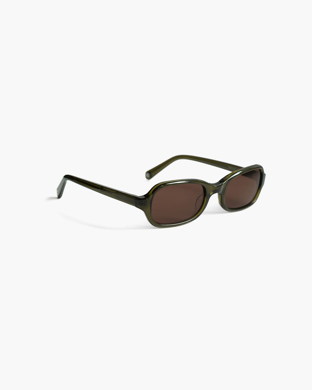 Sunglasses with a green frame on a white background slightly from the side