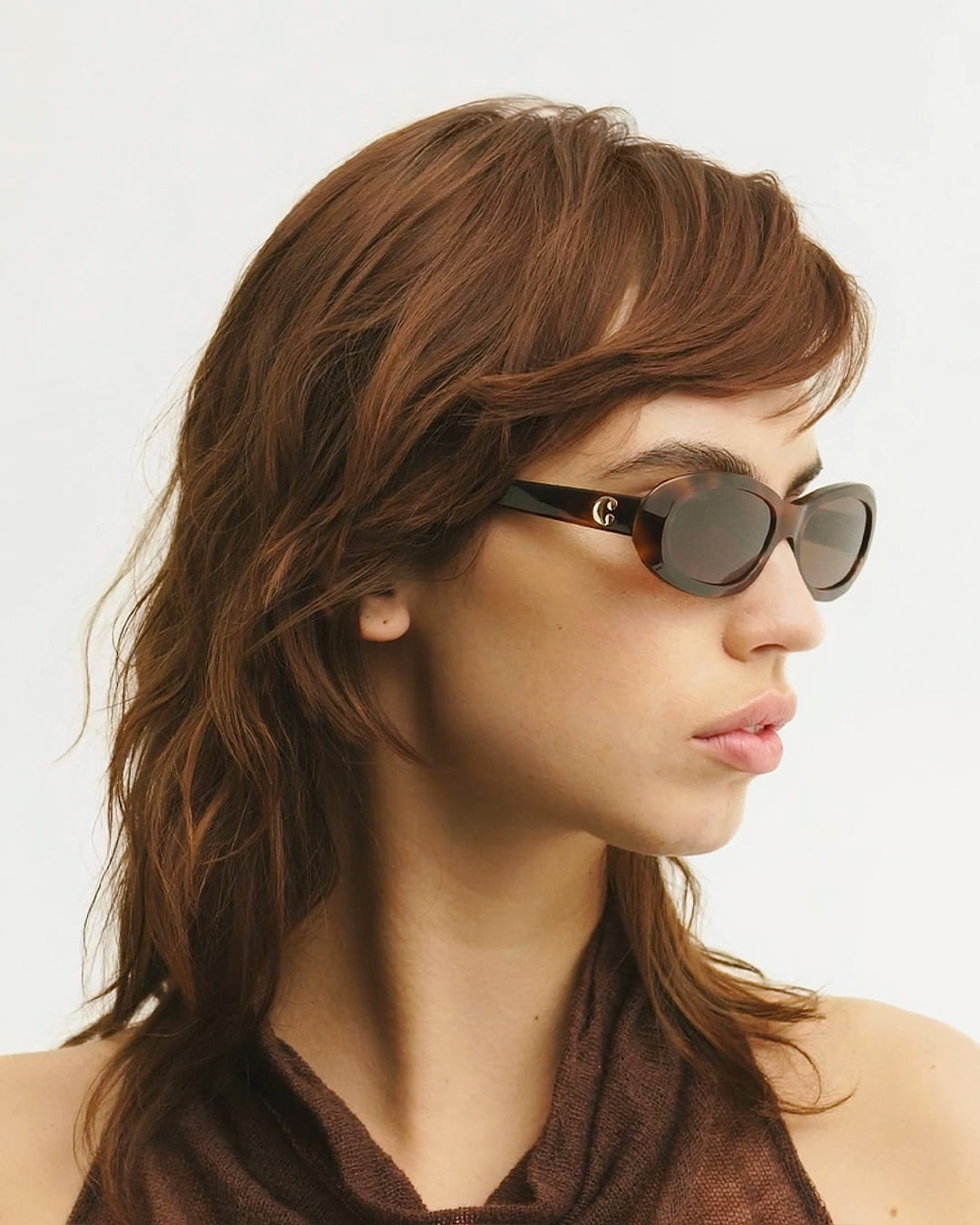 Woman wearing Louis Tortoise Brown sunglasses by Corlin from the side.