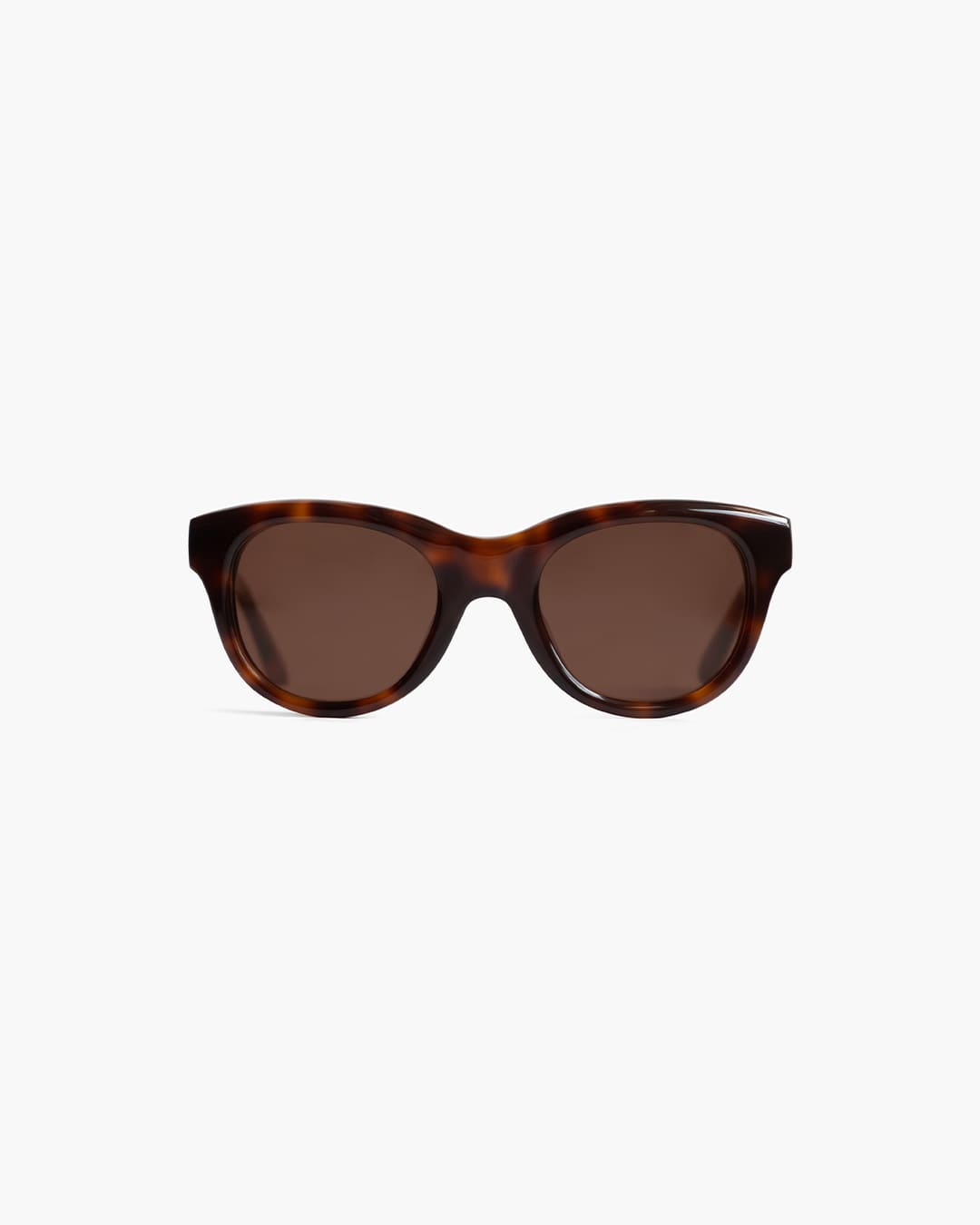 Tortoiseshell sunglasses with brown lenses on a white background