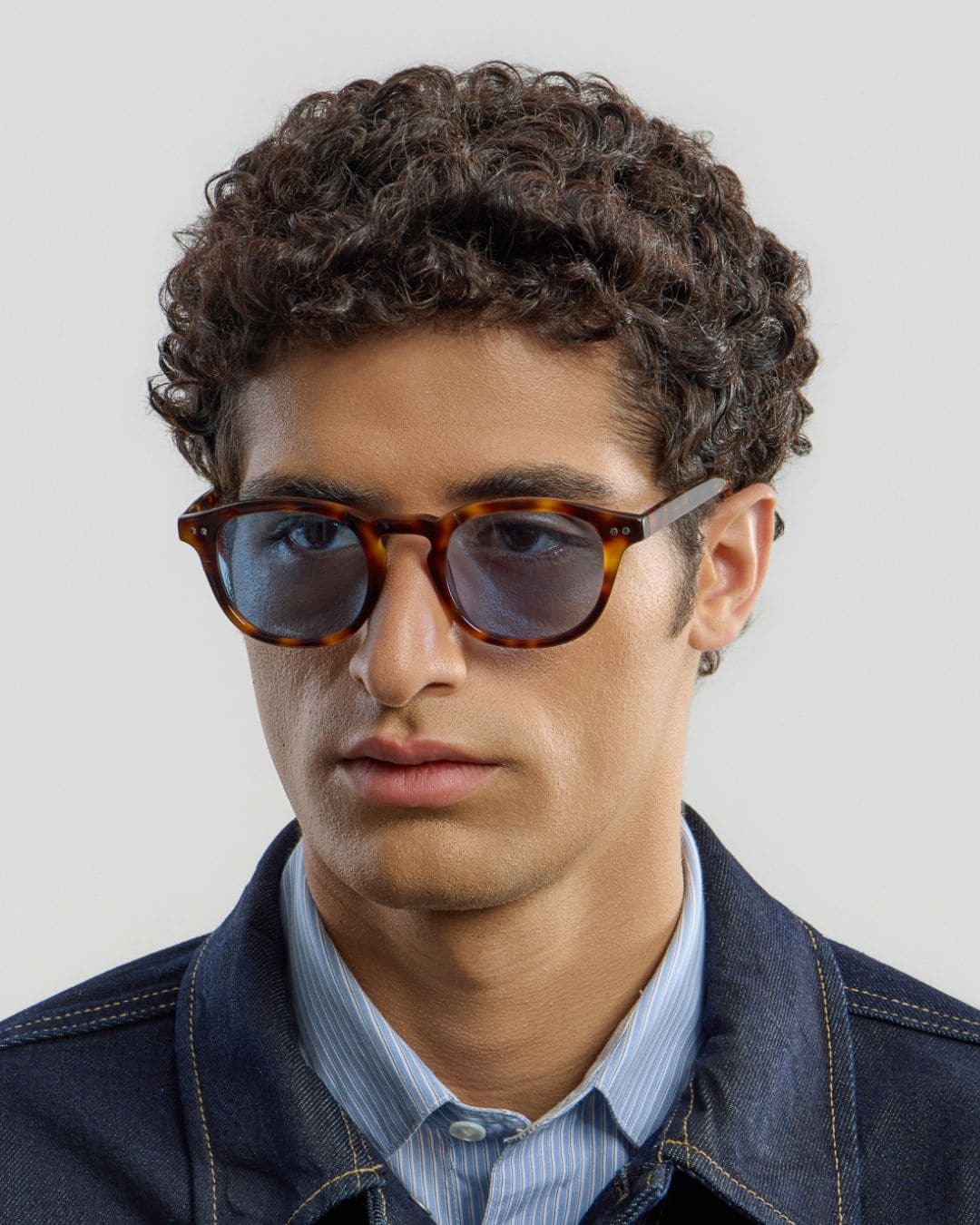 Man wearing Todd Tortoise Blue sunglasses by Corlin from the side.