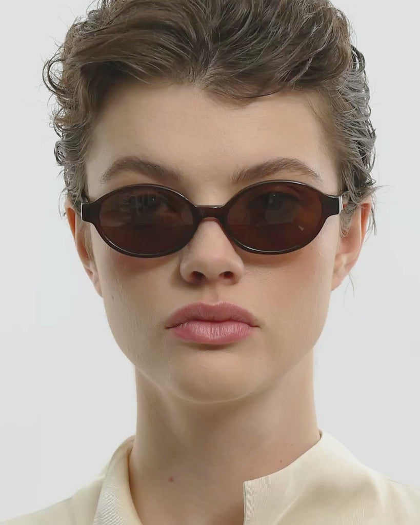 Video of woman wearing selma brown brown sunglasses by Corlin.